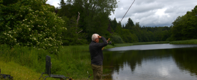 Jon Hettle, founder of Angling Protect, fishing at a UK lake