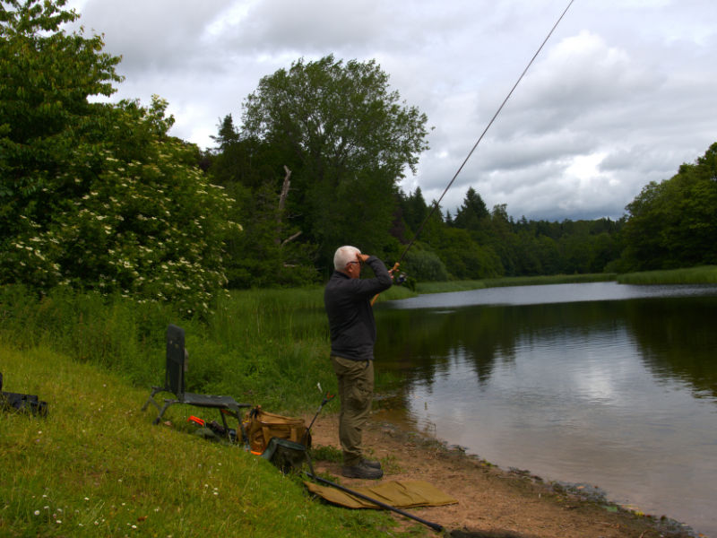 Jon Hettle, founder of Angling Protect, fishing at a UK lake